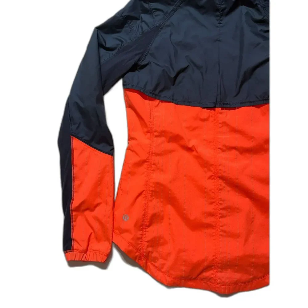 lululemon Get Up & Glow Jacket 4 Orange Navy Reflective Ponytail Hood
